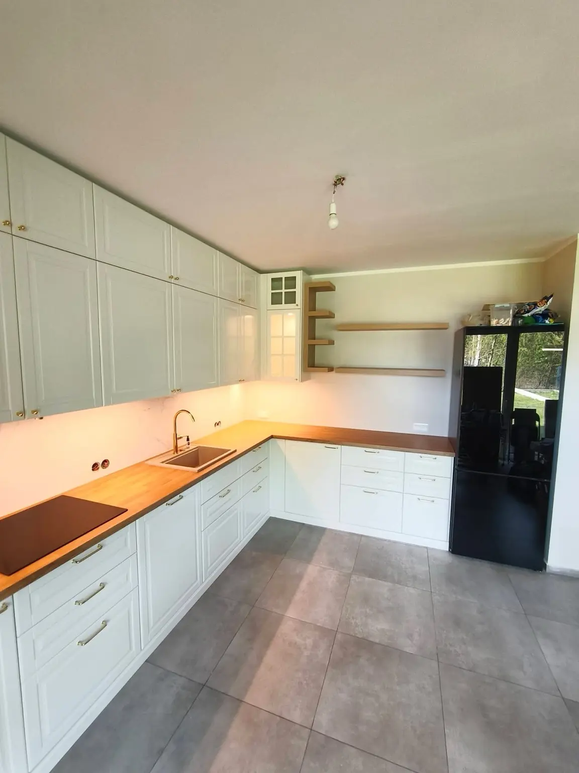 Compact gray kitchen with oak countertop