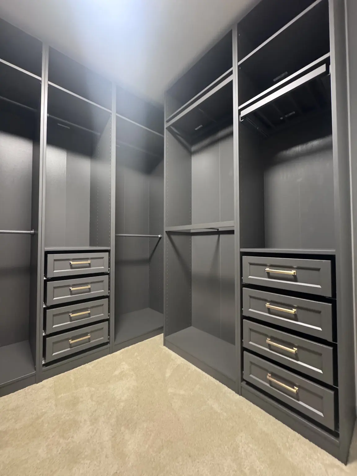 Dark fitted wardrobe with glass-front doors
