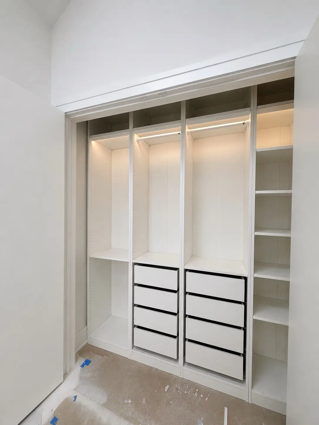 White built-in closet with integrated LED lighting
