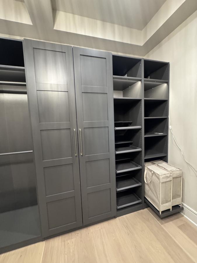 Dark floor-to-ceiling built-in wardrobe
