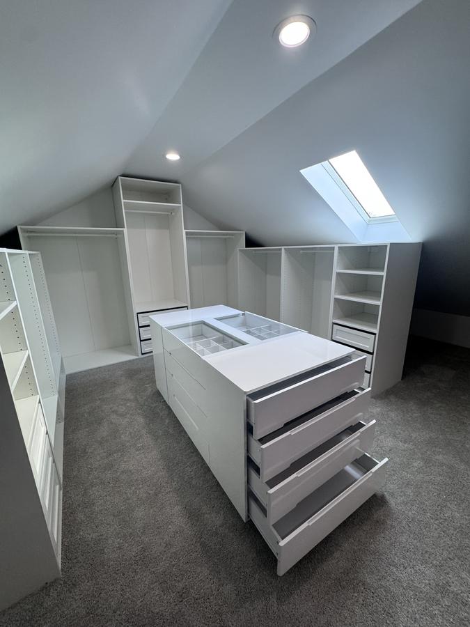 Walk-in closet under sloped ceiling